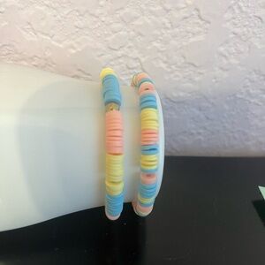 Pink, yellow, and teal clay bead bracelets. Pack of two